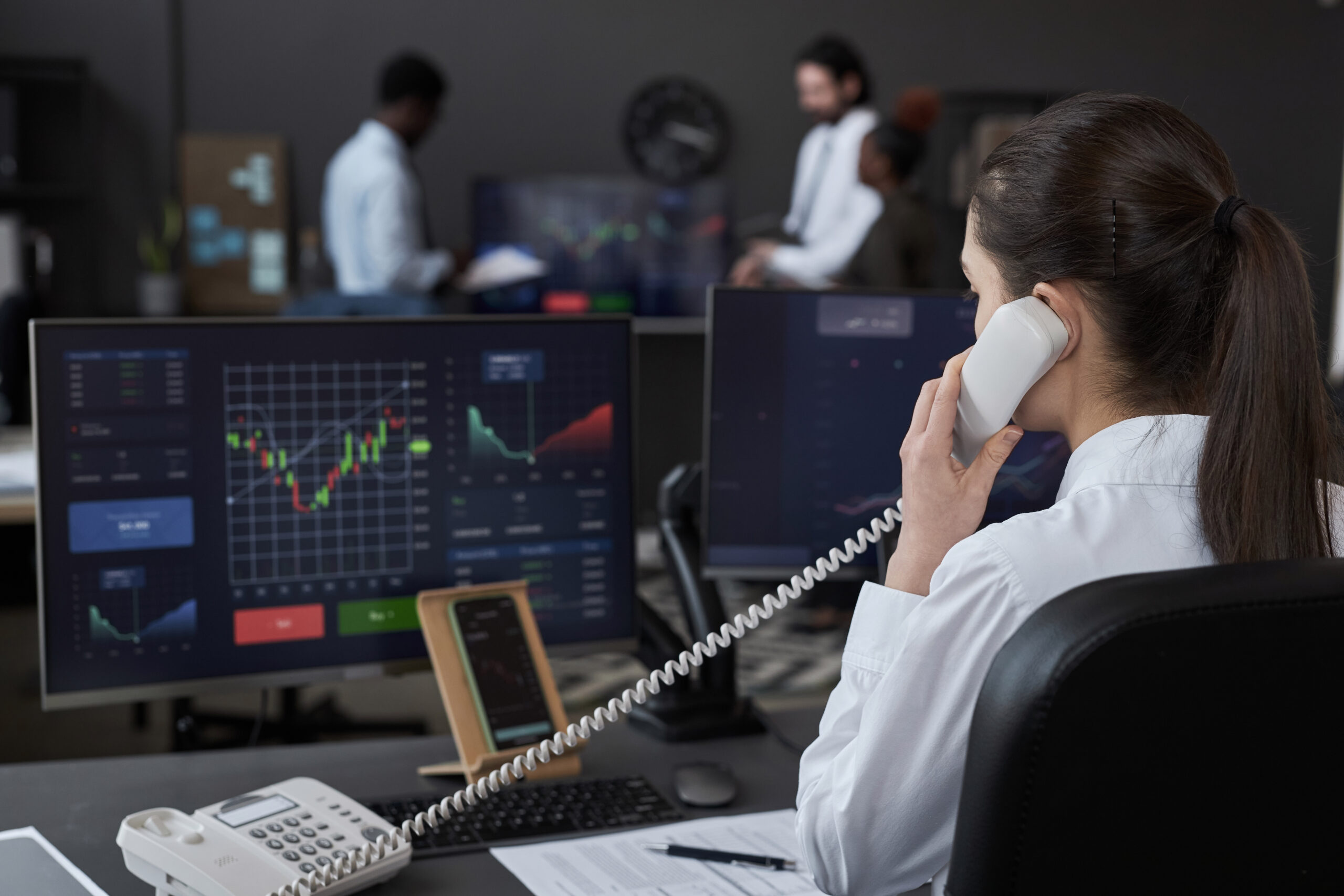Professional on the phone at a workstation