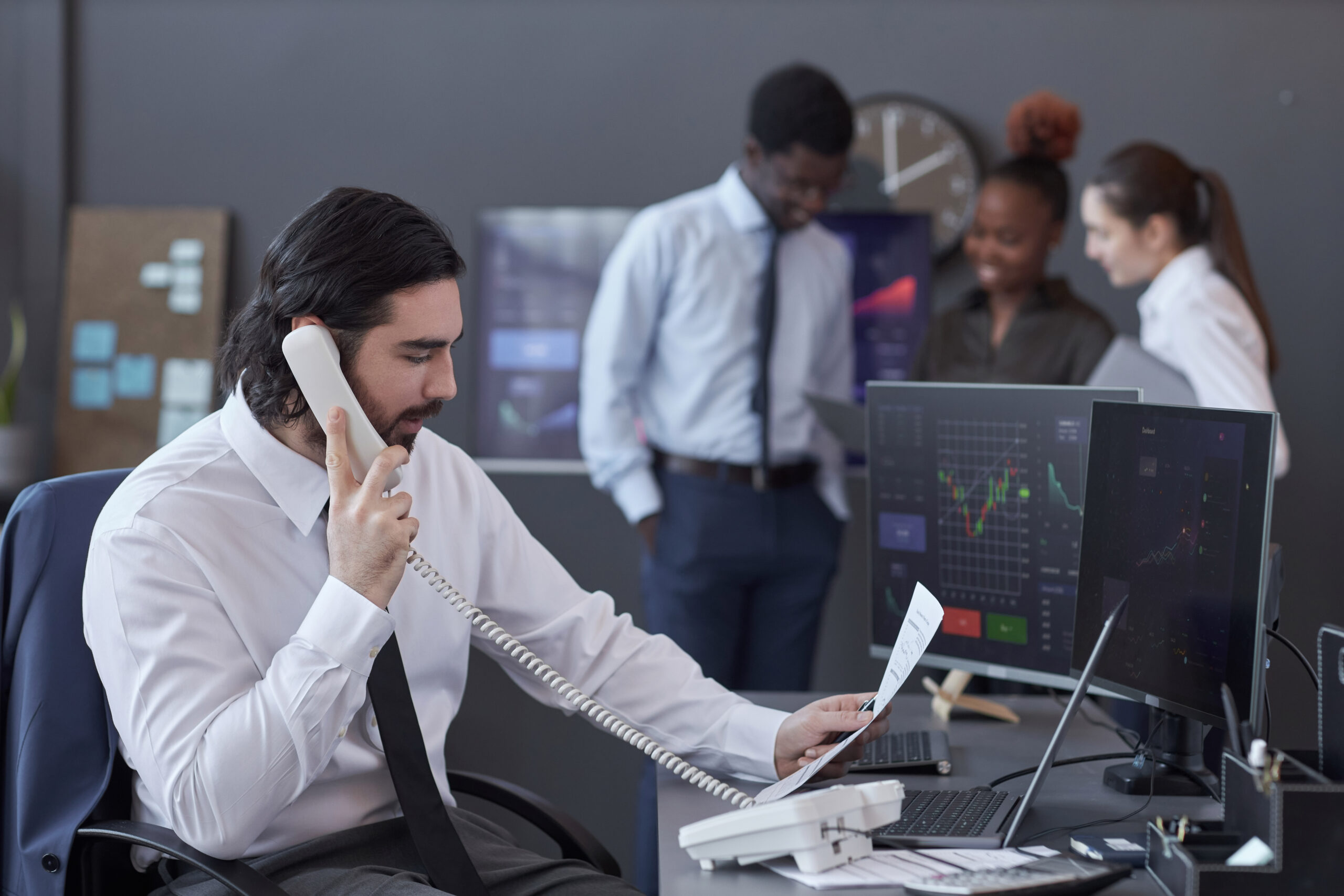 Finance professional on the phone at the office
